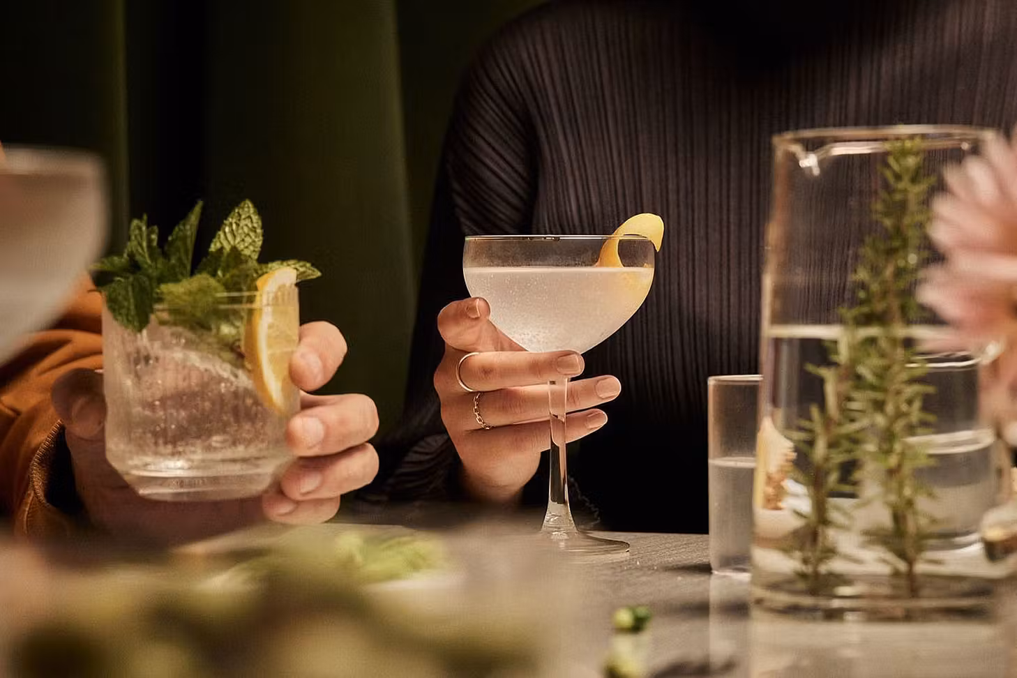 People hold AF Drinks cocktails in their hands.